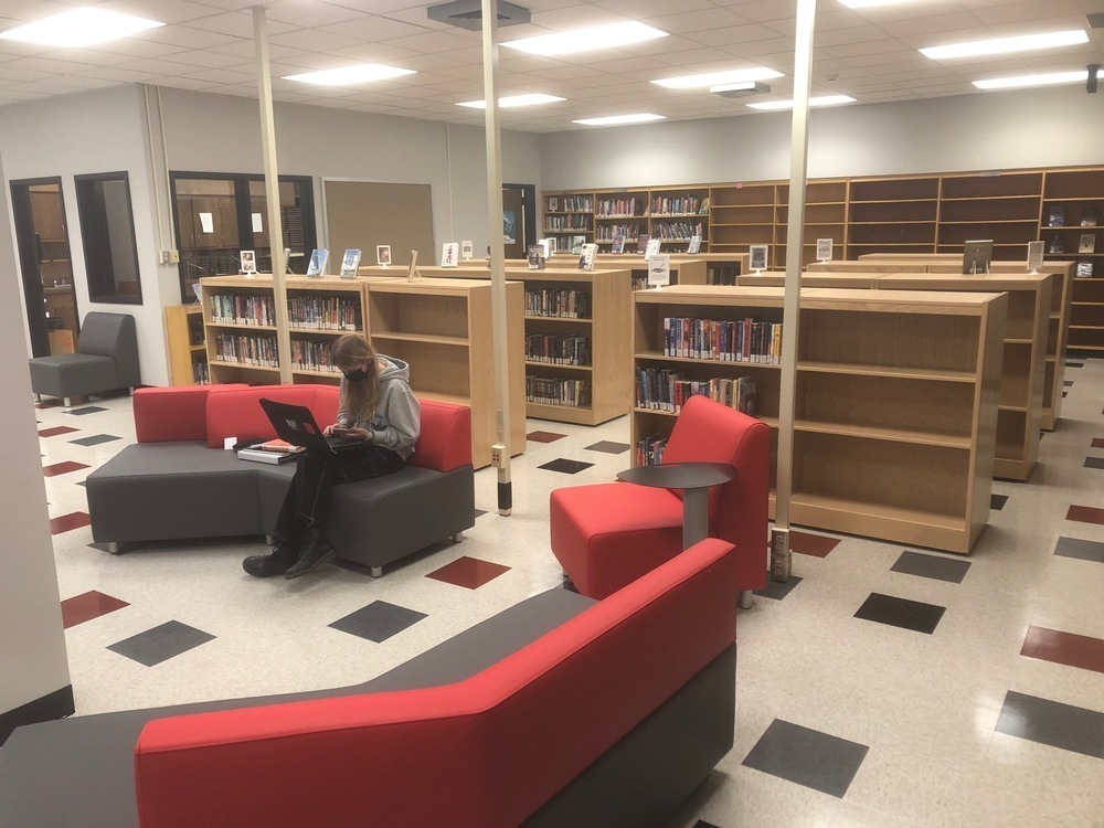 student sitting in the new media center
